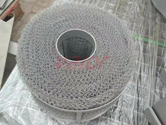 Customized rolled demister leaves space for central tube.